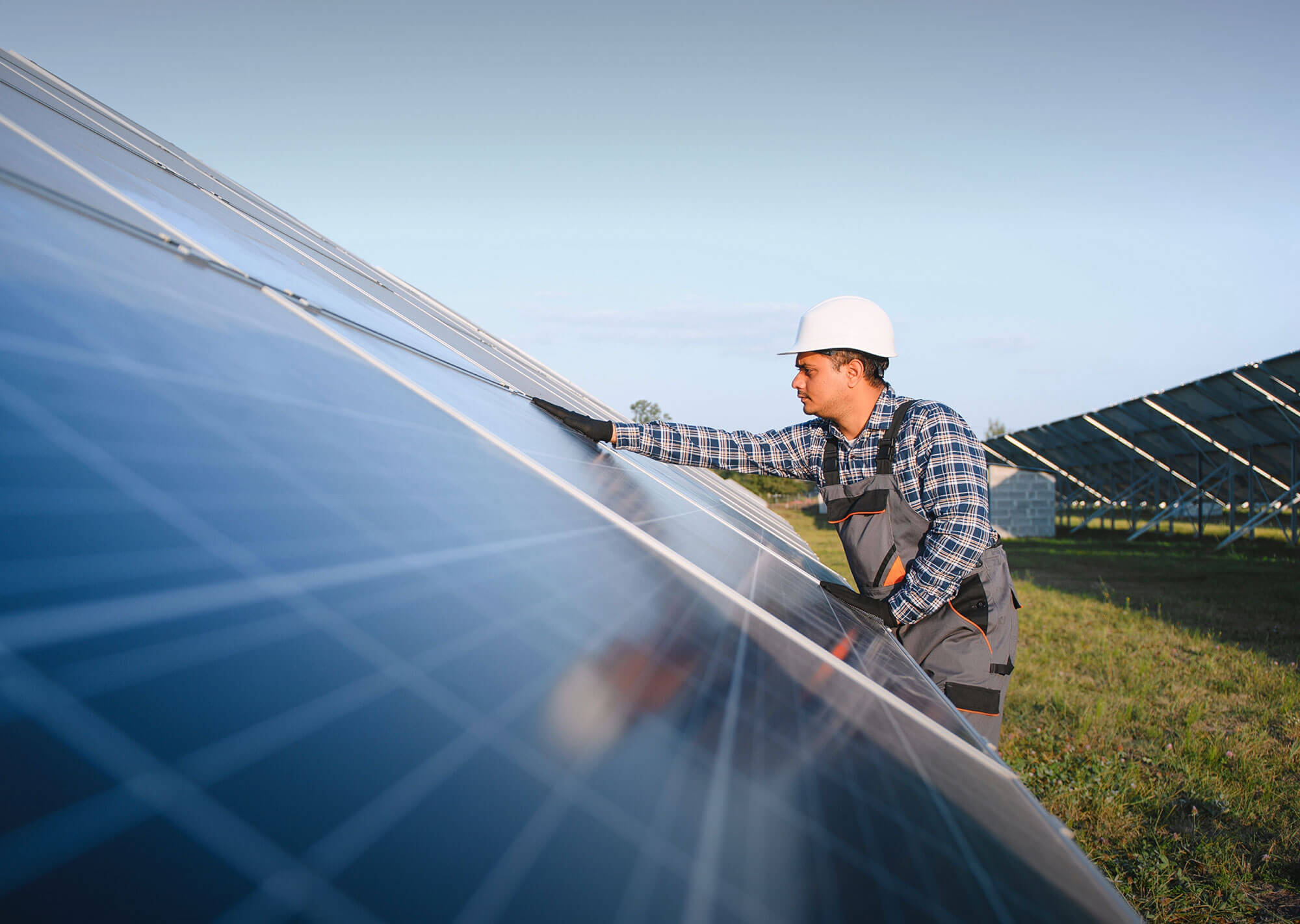 Man cleaning solar panels