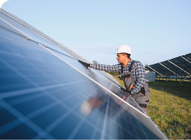 Person Cleaning Solar Panel